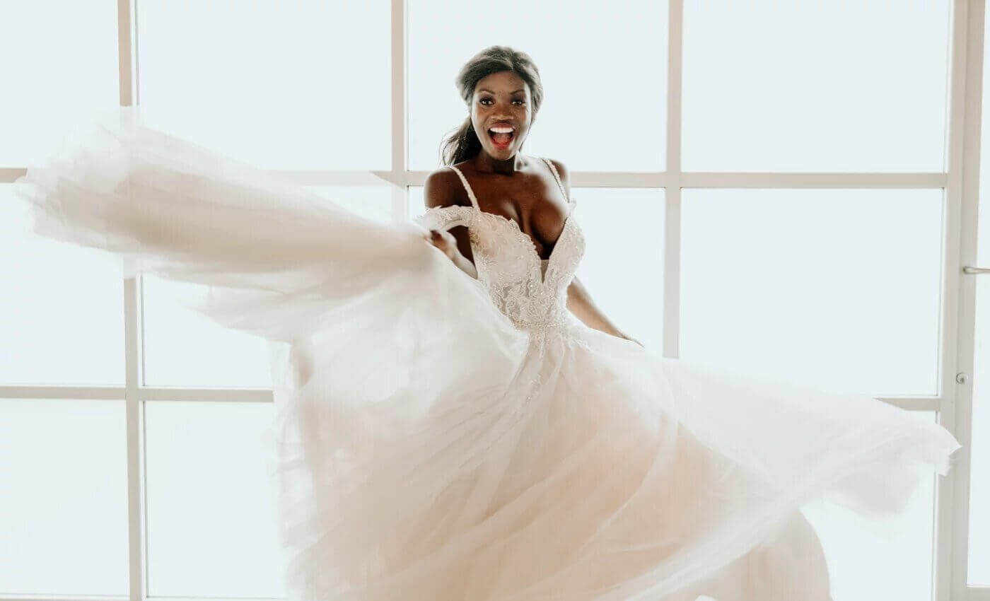 Photo of happy bride in a Bestow Bridal gown