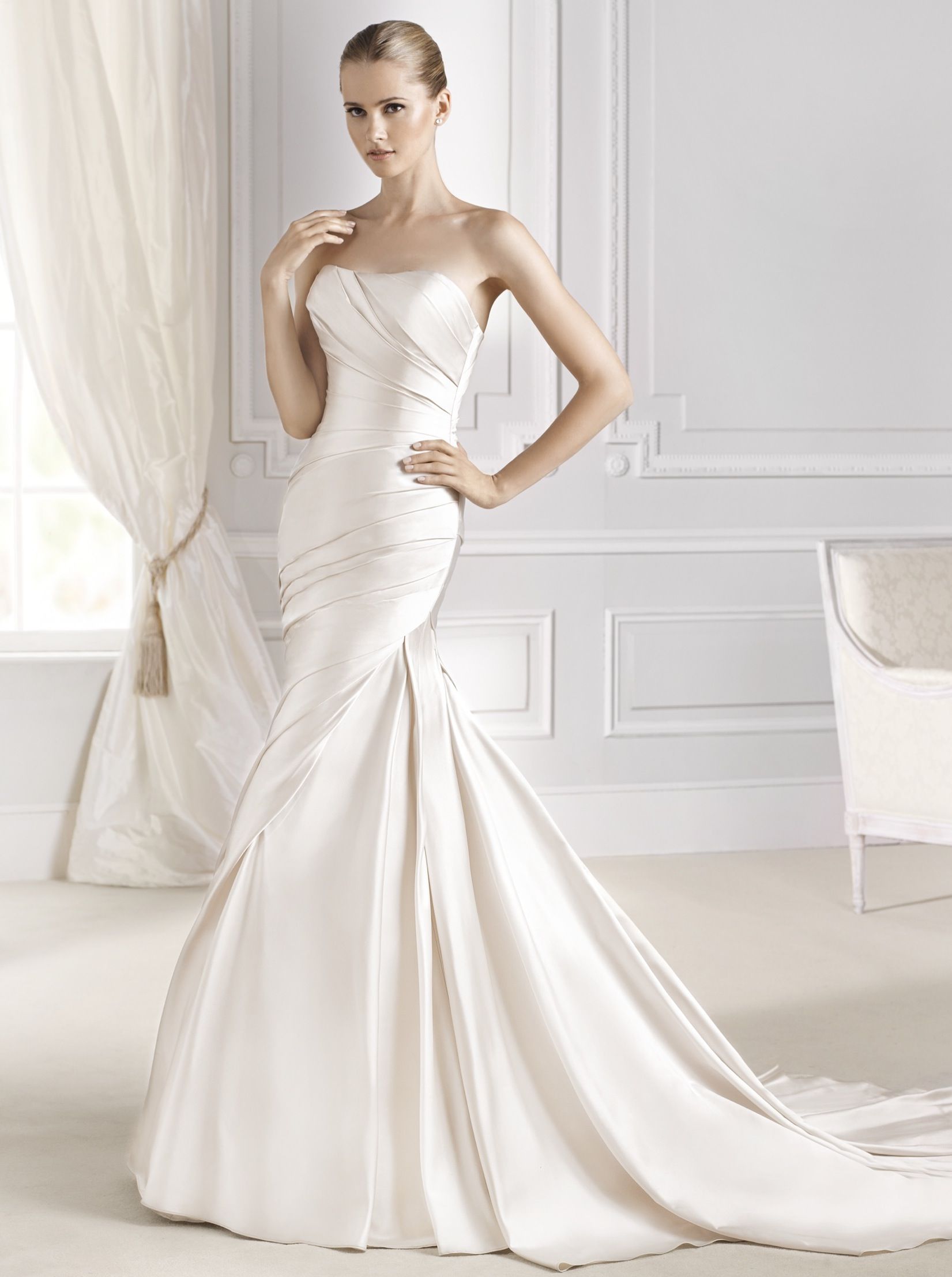 Model wearing a white gown 49