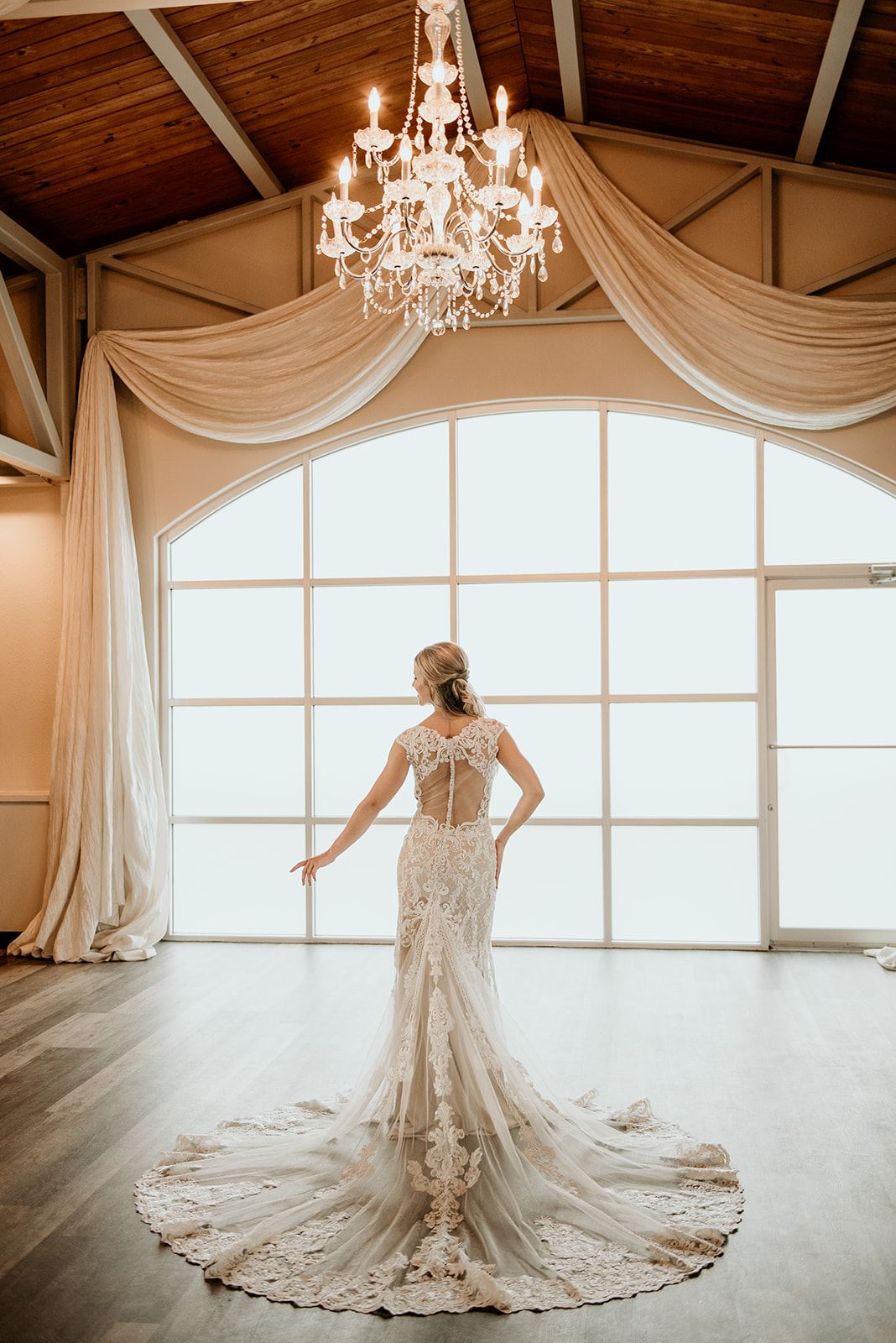 Model wearing a white gown 32