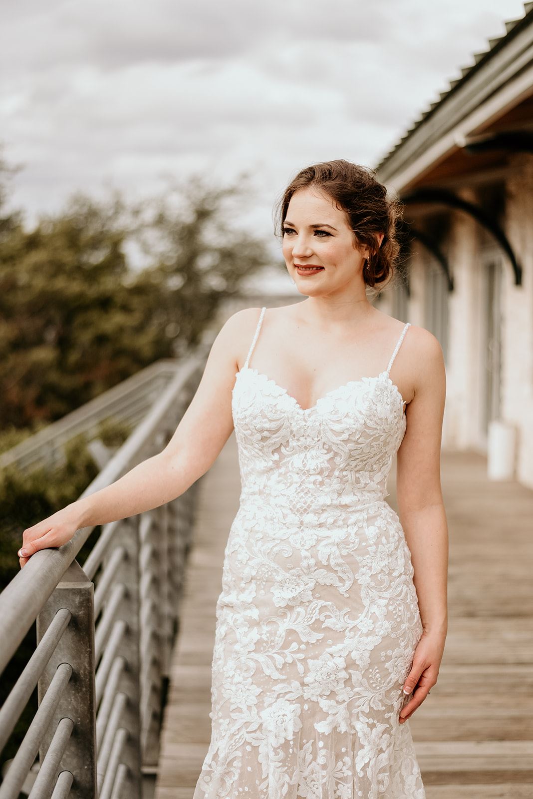 Model wearing a white gown 25